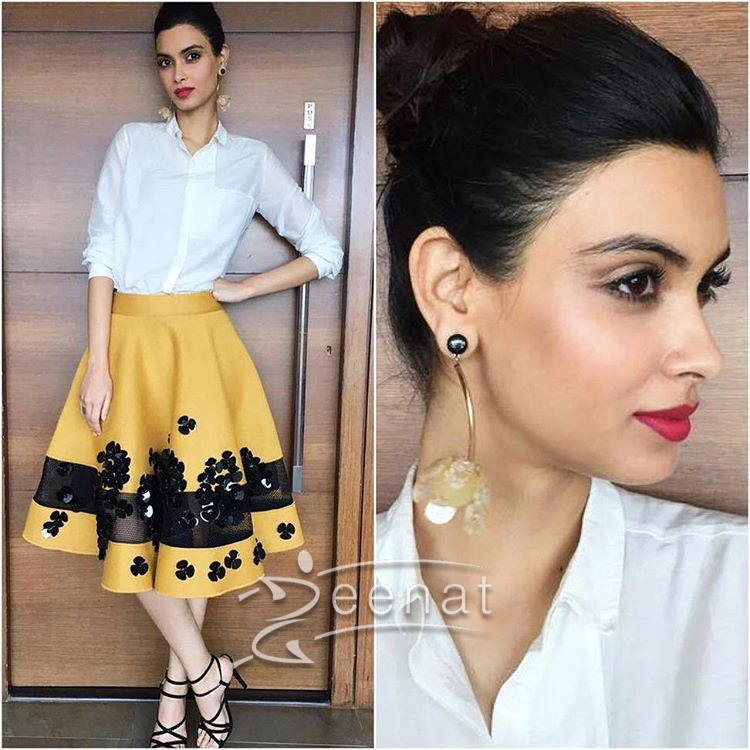 Here she paired this shirt from Bodice with an elegant skater skirt from Dhurv Kapoor. Tie-up heels from Intoto and earring from Mango.